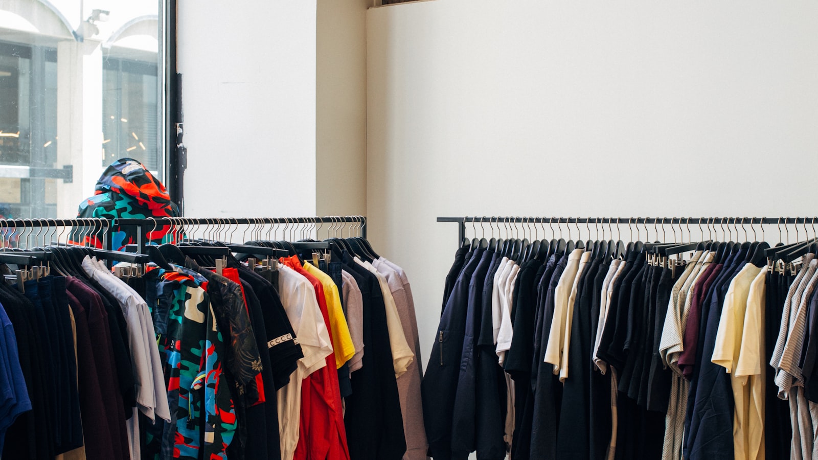 A wardrobe rack of garments a stylist pulls from for an editorial or red-carpet shoot