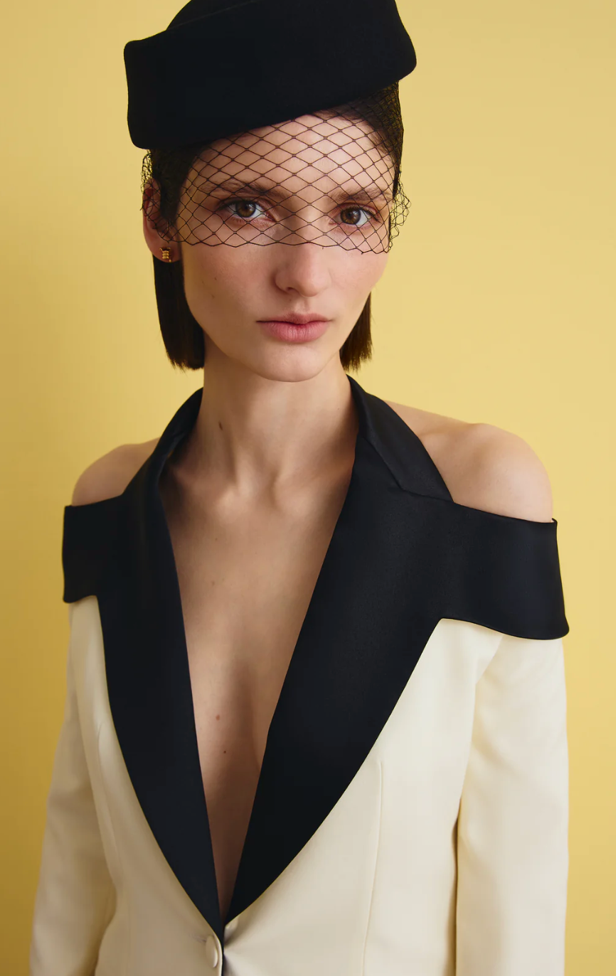 IVORY SUIT WITH CONTRASTING BLACK LABELS